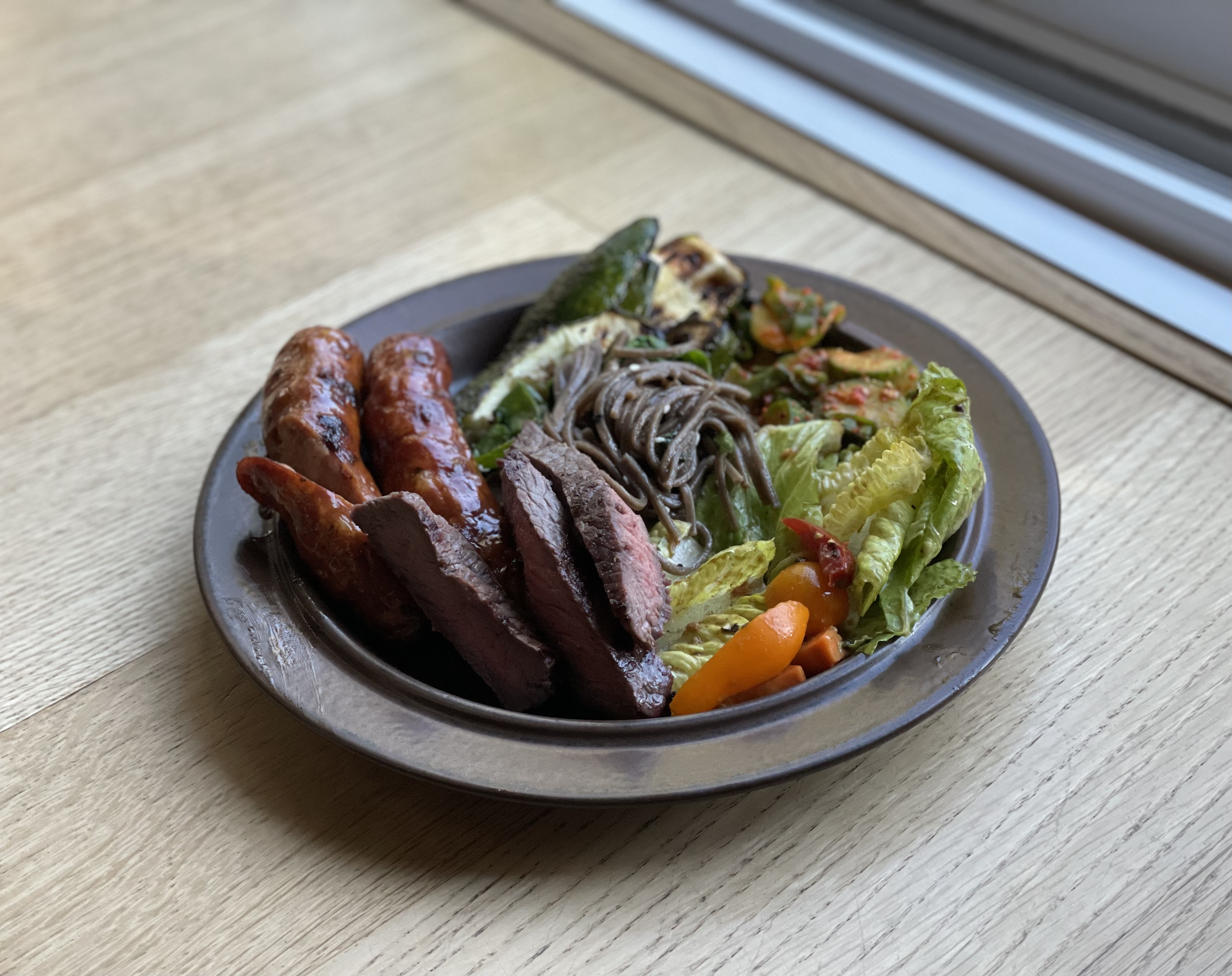 Soft tortillas with sliced meat, shredded cabbage, and lime